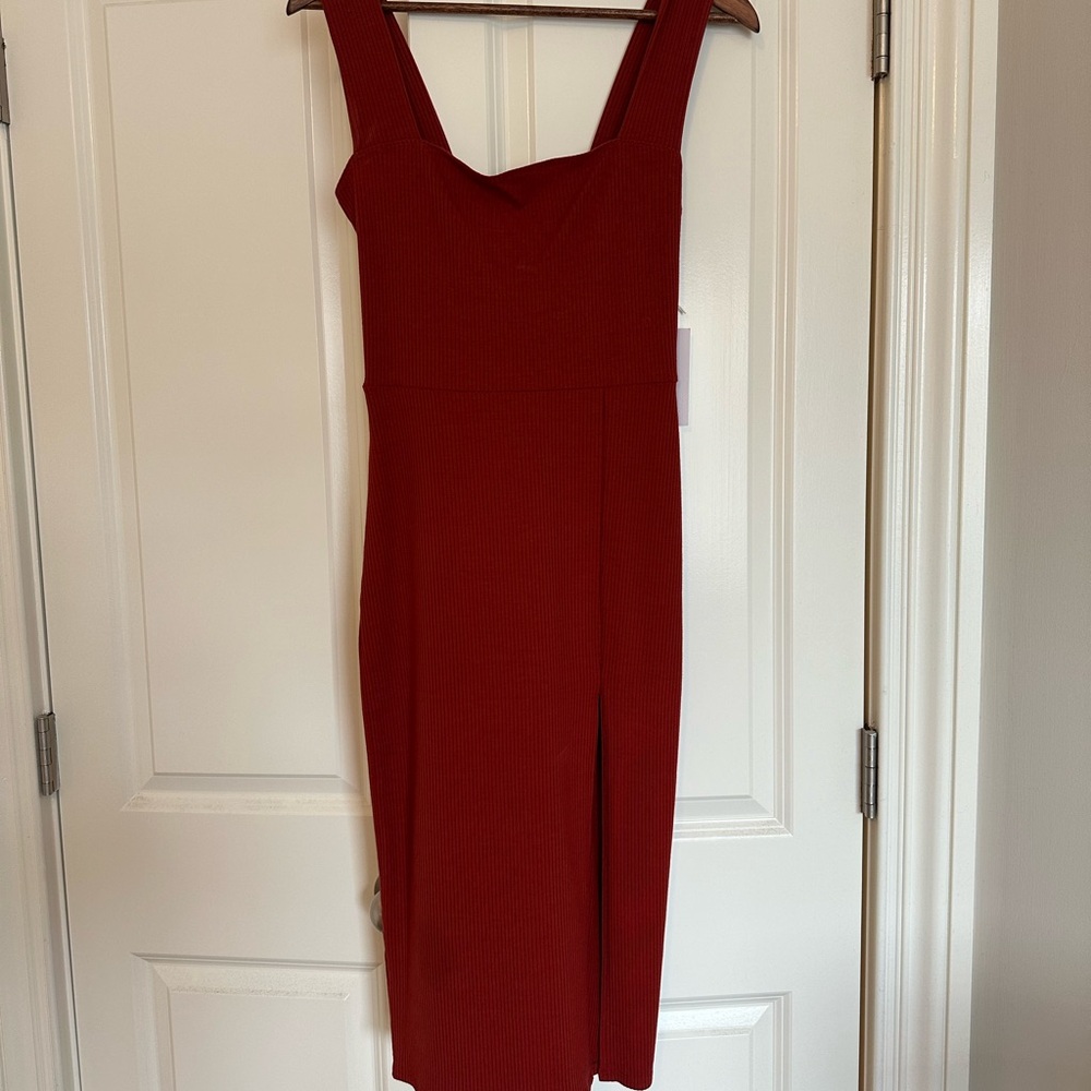 Brand new maxi dress w/ tags. Slit up the front. Size M.